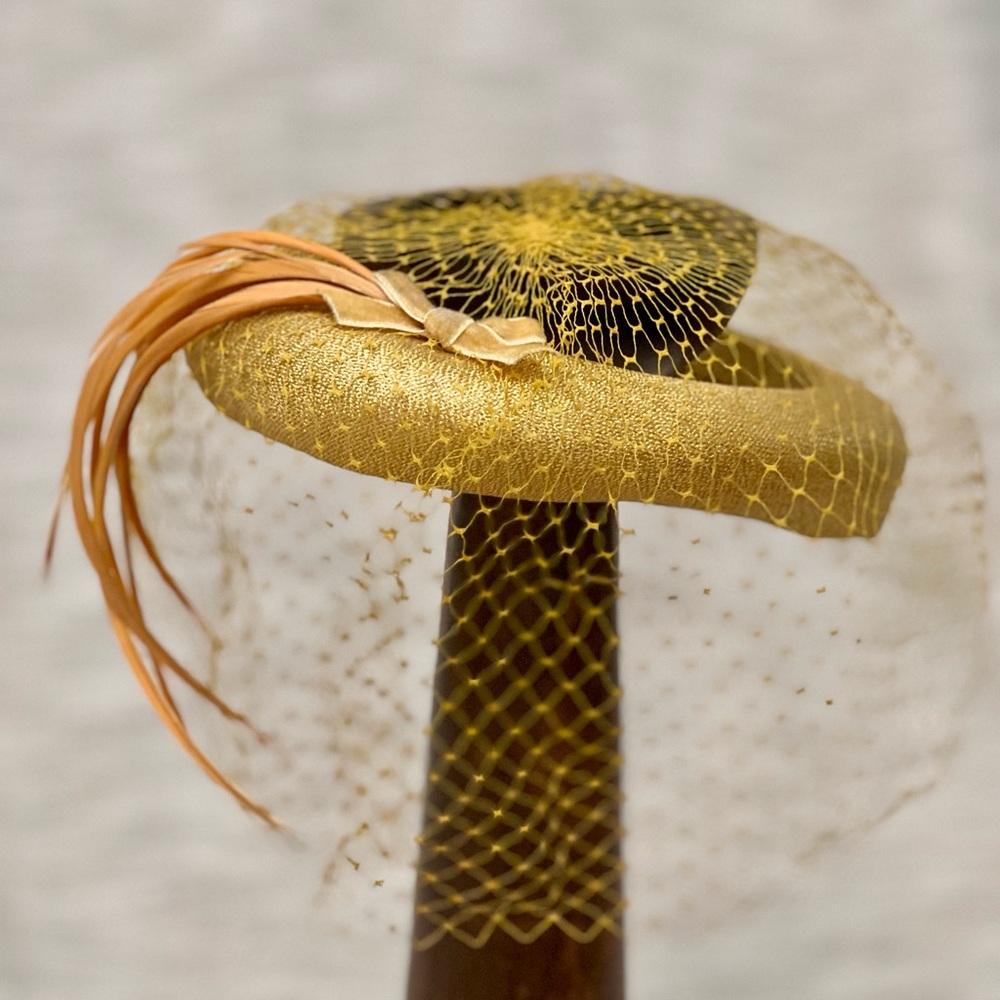 Elegant Vintage Gold hat with Feather Detail